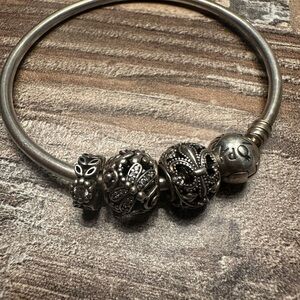 Women’s Pandora Silver Bracelet with two charms and a stopper charm. Genuine